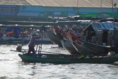 Authentic Mekong Delta Floating Market Full Day: Private or Group - Watching sweets, rice wine, honey, and puffed rice get made