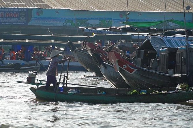 Authentic Mekong Delta Floating Market Full Day: Private or Group - Watching sweets, rice wine, honey, and puffed rice get made