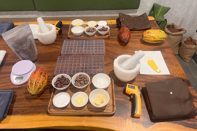 Bean to bar Chocolate Workshop in Ho Chi Minh City - Making cacao paste with a granite stone mortar