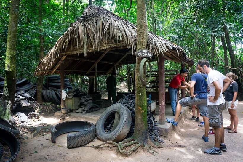 Cu Chi Tunnels Afternoon Trip from Ho Chi Minh City - Entering Cu Chi: Photo Stop, Guided Tour, and a Lot of Walking