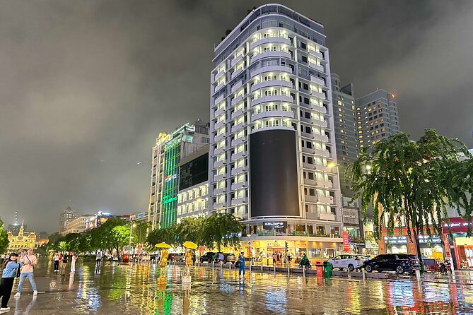 [Free E-sim] Evening Walking Tour in Saigon - Stop 1 at % Arabica: coffee-shop photos and street energy
