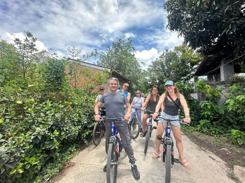 From Ho Chi Minh: Cai Be Boat & Bike Mekong Delta Experience - Gliding Through Canals Under Coconut Trees (Sampan Rowboat Ride)