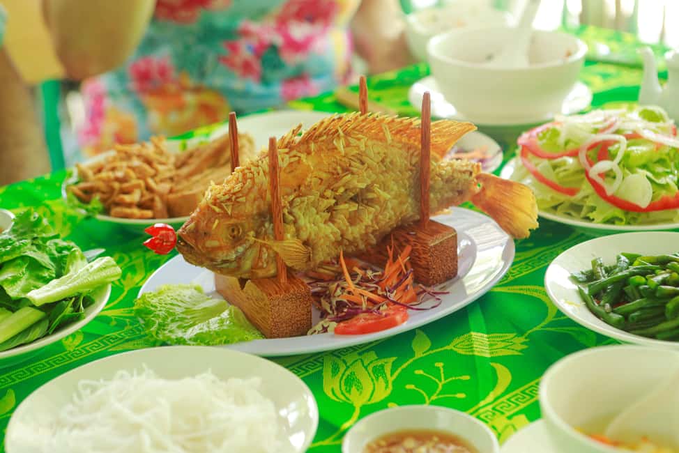 From Ho Chi Minh: Mekong Delta Tour to My Tho & Ben Tre 1Day - Vinh Trang Pagoda: a still moment with clear cultural meaning