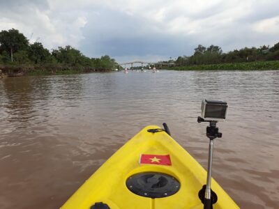 Full Day Experience Mekong River Life By Kayak & Boat. - Entering Cai Be Floating Market: boat views and seasonal fruit time