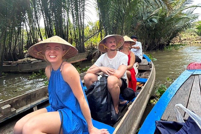 Mekong Delta Guided Tour from Ho Chi Minh City - Rowing Through Smaller Canals Under Foot Bridges