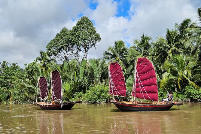 Mekong River Relaxing Sail boat cruise to Coconut Canals (1.5HRS) - Stop 2 Nhơn Thạnh: coconut palms, fruit trees, and a winding tributary