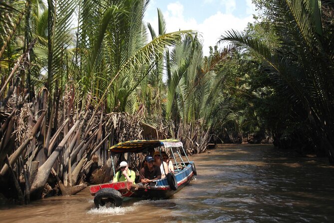 Private Mekong Delta Less Tourist - Coconut Island Tour - Vinh Trang Temple stop: a cultural mash-up you can actually see