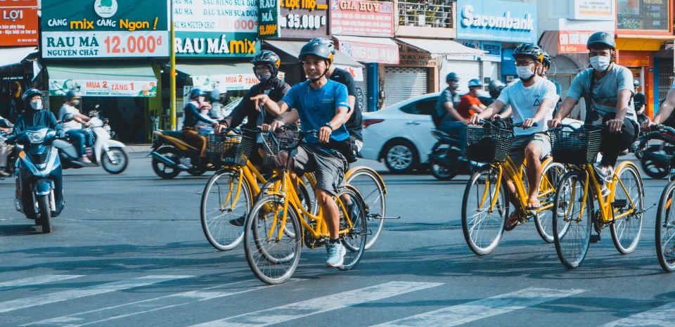 Saigon Off-the-Beaten Path-Cycling Tour in Ho Chi Minh City - District 10: Umbrella Market fruit tasting and Flower Market rules