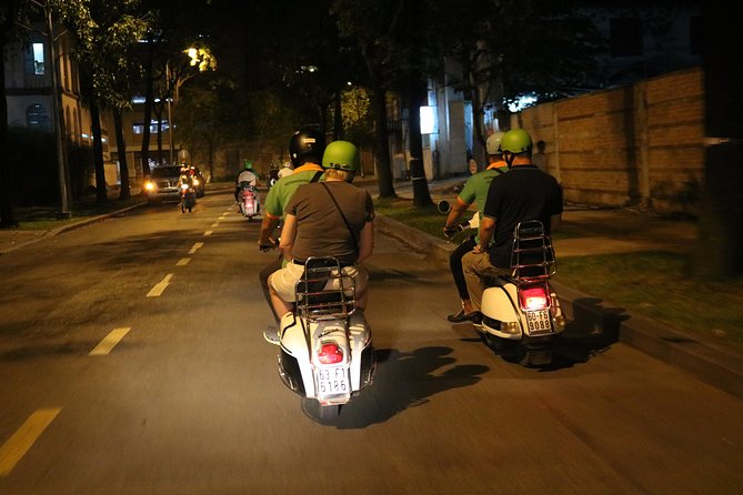 Saigon Vespa By Night Street Food Tour 4,5 Hours - The first stop around Ho Chi Minh Square: getting your bearings fast
